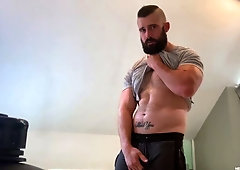 Beefy bearded hunk Mathias jerks his cock