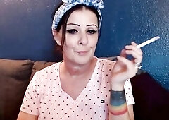 Its your fortunate day. Sit and have a fun a smoke with this pretty woman who's smokin' down on her cigarette. So yummy and relaxing. Wind d
