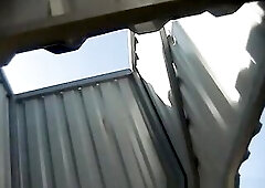 Much unshaved cutie dresses in the dressing room on the beach.