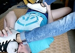 Sweaty twink in denim and socks pleasures me with a footjob