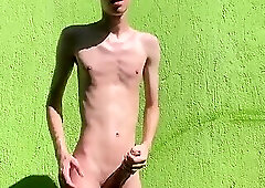 Skinny twink showing his body outdoor and cums at the sun