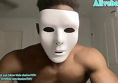muscle black man in mask shows off his hot body