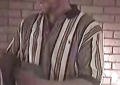 Mature guy with tattoos is jerking his throbbing manhood