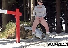 Gals in need skate around in the snow to discover a proper place to have a pee