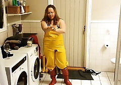 Foreplay in washroom with large bazookas in greasy rainwear and rubber boots