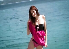 Katie Gold is a vibrant, freckled teen hotty who embodies the essence of summer at the beach. Her sun-kissed skin is dotted with playful freckles, a n