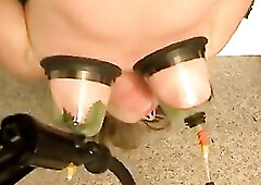 Head down hanged woman gets clitoris and nipp punishment with nettles