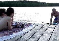 2 cuties took their raiment off on the lake. A passing surfer had sex in the open air.