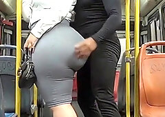 This thick masked secretary with a biggest butt is riding a crowded public bus. A stranger stands right behind her the whole tour and this babe teases