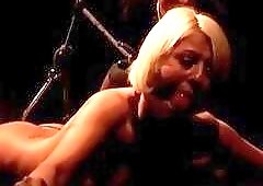 Busty blonde slave is extremely dominated in dark BDSM dungeon