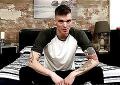 Dashing gay dude with tattoos tugs on his fat dick