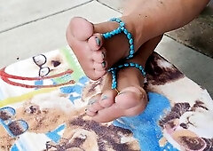 Relaxing on the back porch trying on foot jewelry