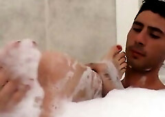 Colored hair older gets cum on bazookas after butt banging in the bath.