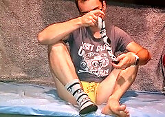 Twink gives handjob to a hung guy and enjoys a big cumshot