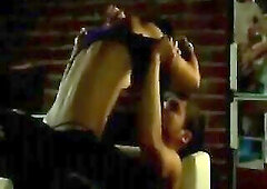 Ana de Armas making out with a stud against the door of a washroom stall, pulling her costume down to disclose her worthy tits, which the stud sucks o