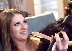 Adorable couple Rebecca Volpetti and Jack are sitting under the Christmas tree, preparing to exchange gifts. Rebecca opens her first present and is ve