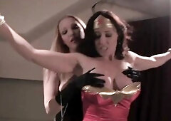 Breasty Wonder Woman was caught, bound up and tortured by merciless Female-Dominator, in the basement