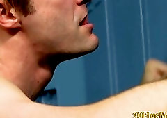 Cock tugging stud spunks over himself