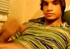 Hung lad films himself jerking off his massive gay cock