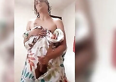 Marvelous sissy femboy, comes without the shower in a short towel and undresses in nature's garb and provokes with her body playing with her boot