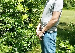 Steaming fellow urinating outdoors!