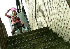 Brunette hair uses sextoy to cum in the back alley