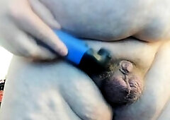 Molly is shaving her genitals whilst sucking on her vibrator. This Babe is shaving her hips and stomach. This Babe is wearing a satin camisole a satin