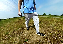 Freeballing walk in nature with a yam-sized sweatpants erection