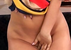 A brunette with no hair on her pussy is posing and jacking off