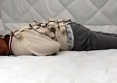 Asian woman in a straitjacket and padded cell