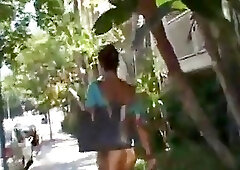 Girl in cross belts and fishnets does dirty things with shemale