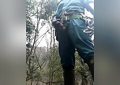 jerkoff Japanese powerlineman in uniform and rubber boots