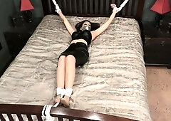 Tied spread out on the bed