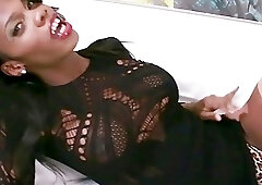 Black tranny with big tits Brooke Morgan masturbates on sofa
