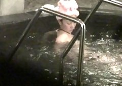 Cute Oriental girl reveals her tiny boobs and hairy beaver