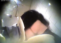 in the toilet catches an Asian sweetie peeing