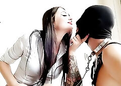 Domina Nika passionately kisses and bites her serf, beats him on the cheeks, kisses him anew