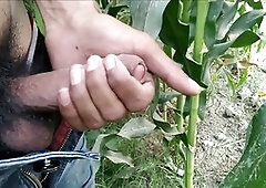 Indian guy gives himself a handjob outdoors and finishes off with a cumshot