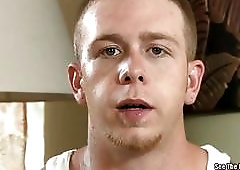 A Fleshlight engulfs this tattooed guy's big boner