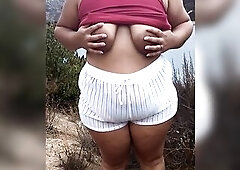 Flashing my large boobs and large booty to any voyeurs on the public lake during the time that hubby films