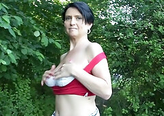 Busty mature flashes her naturals in public to a young man
