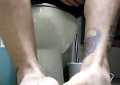 Stud in Douche Demonstrating his Soles and Socks