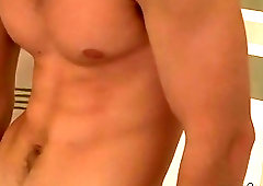 Horny jock pulls his big dick out to stroke it