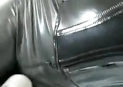 Girl in Rubber with Bag on Head and Vibrator