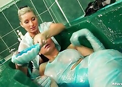 These babes have plenty of slimy blue soap to work with, really rubbing it into those dresses and getting nice and sensual with each other, with Vanes