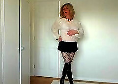 Black fishnets, miniskirt and see-through blouse