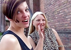 Two naughty ladies, Roxy and Rosella are showing their pussies in a public place and pissing