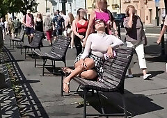 Pantyless European MILF vixen flashing her pussy in public