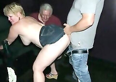 Curvaceous blond granny is getting drilled in the cinema, by a group of excited boyz