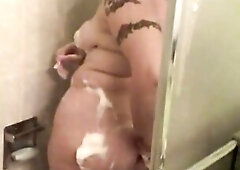 Bulky babe gets moist and soapy in shower